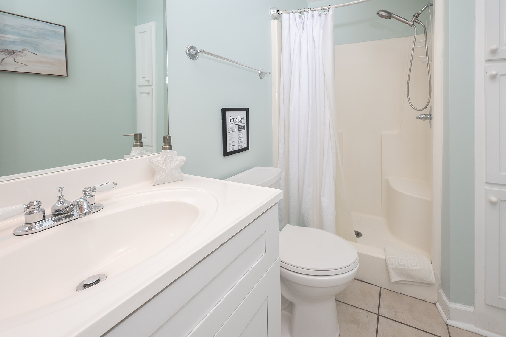 Main bathroom — clean and coastal