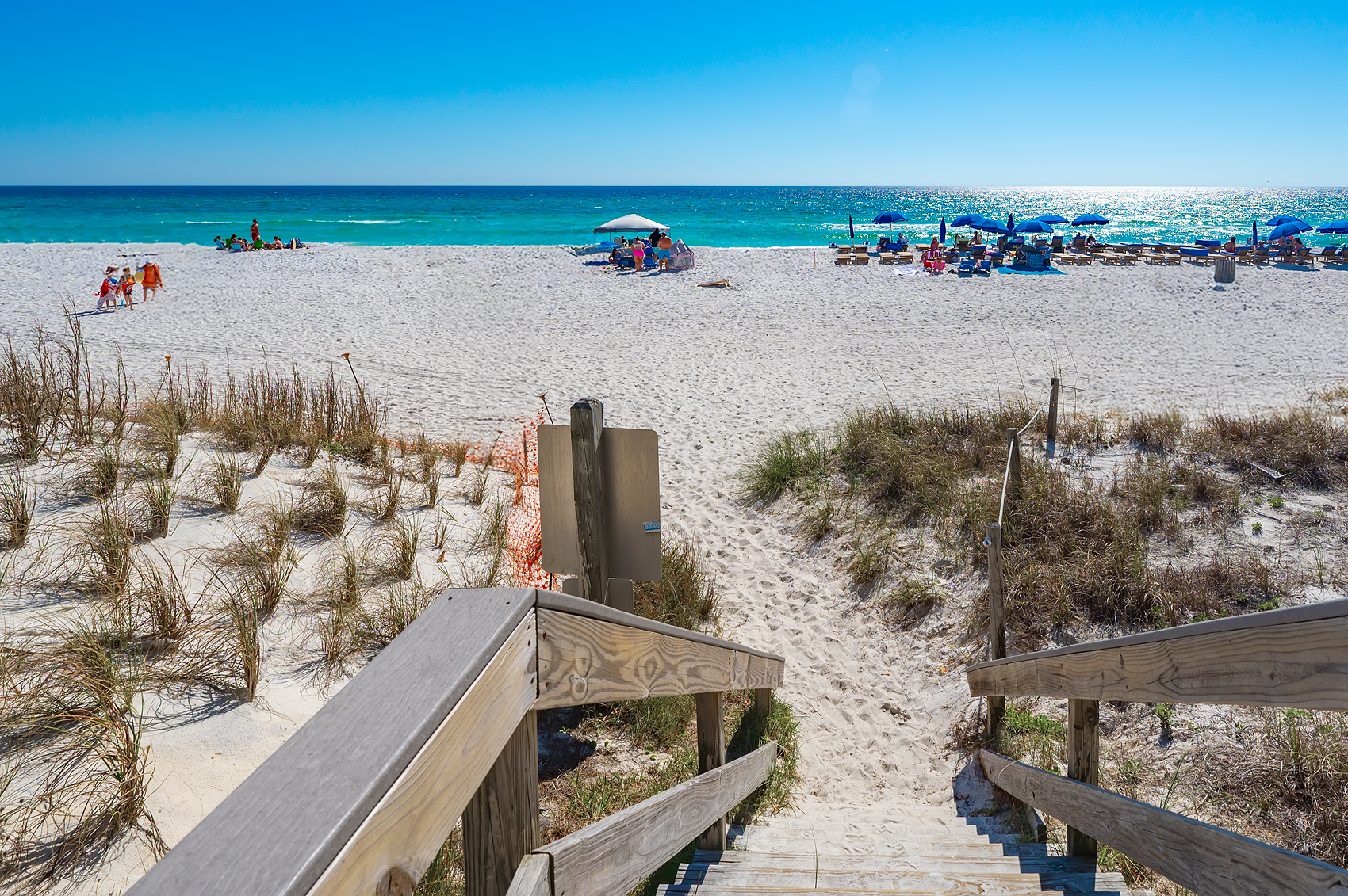 Steps to the beach — sugar-white sand and emerald Gulf just one block away