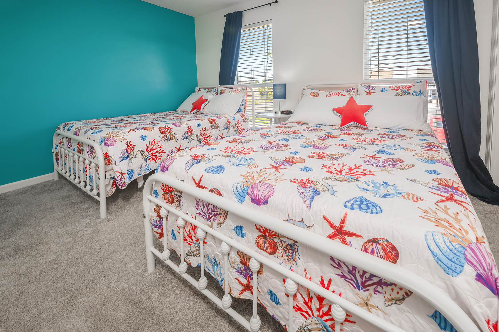 Second bedroom with two queens and coastal bedding