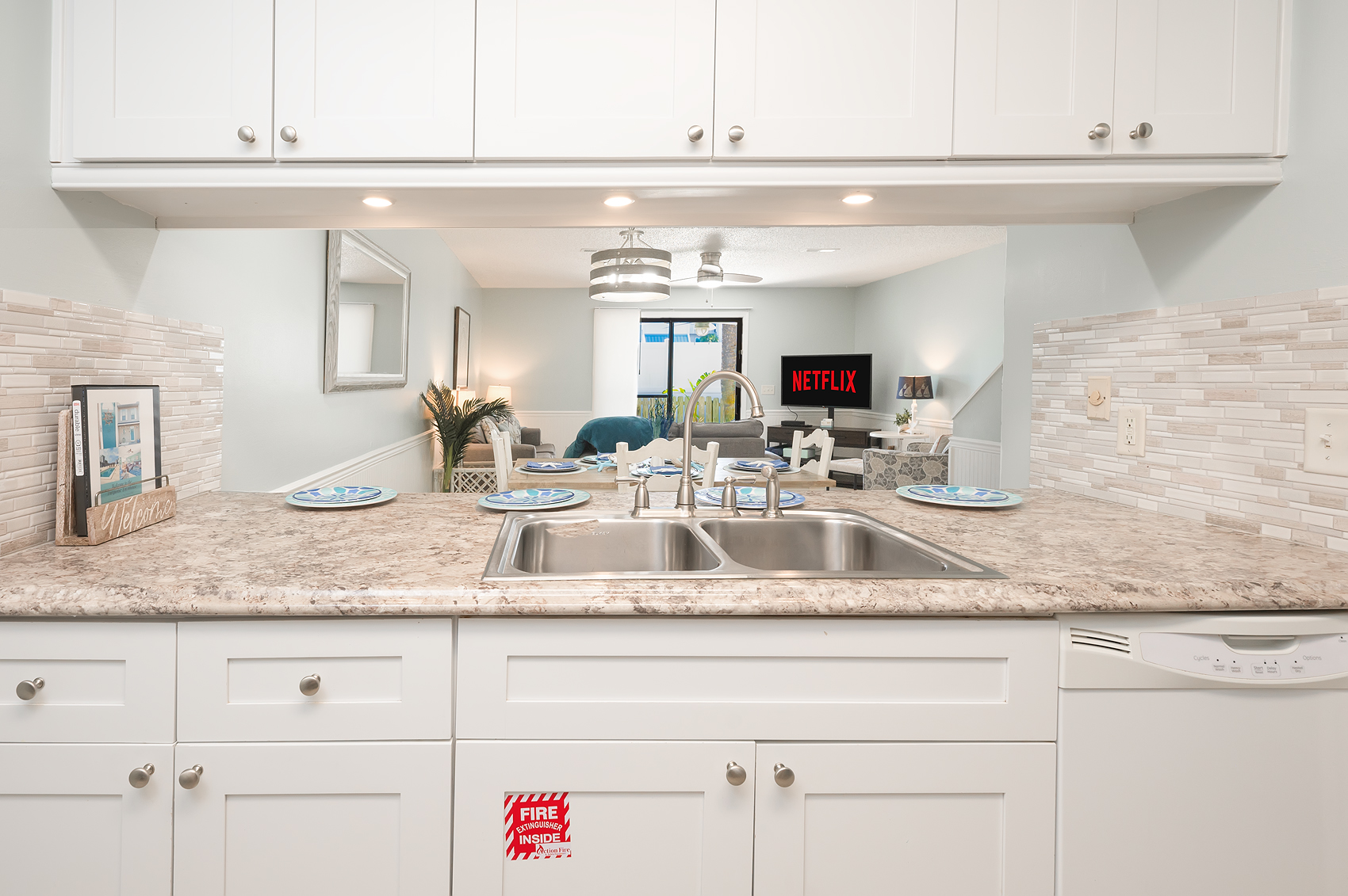 Fully equipped kitchen with open pass-through to living area
